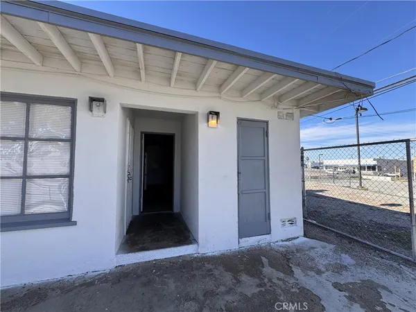 a view of room with window and entryway