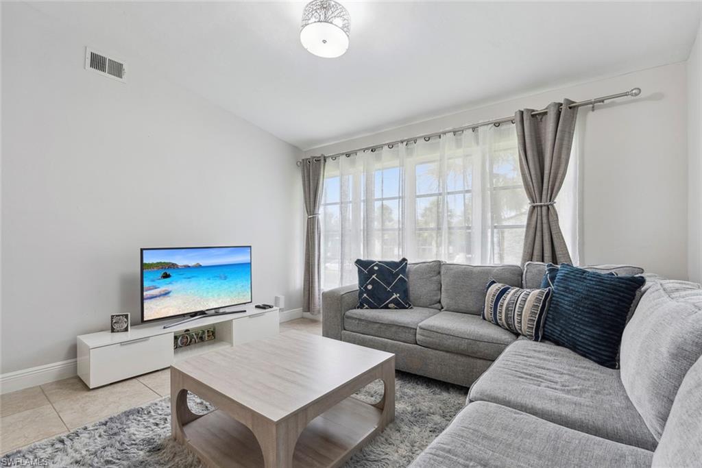 3410 Frosty Way, Unit 4802 Naples, FL 34112 - Photo 17 of 27 Living area with baseboards and light tile patterned flooring