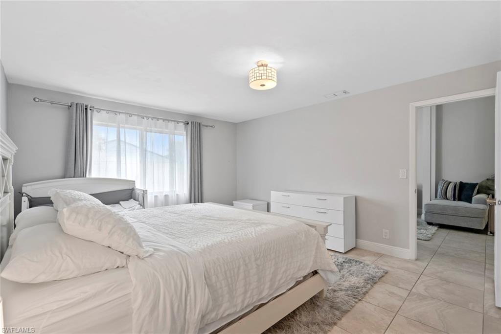 3410 Frosty Way, Unit 4802 Naples, FL 34112 - Photo 25 of 27 Bedroom with light tile patterned floors