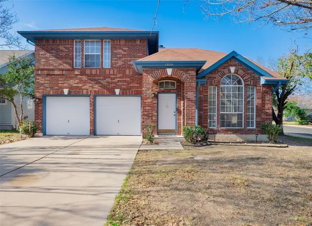 a front view of a house with yard