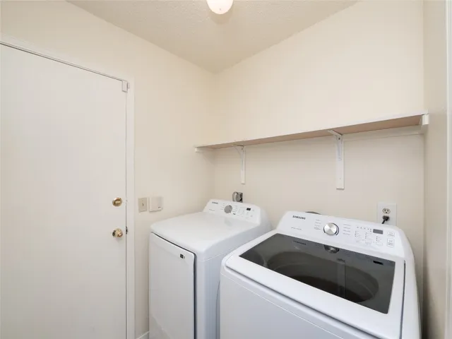 a utility room with dryer and washer