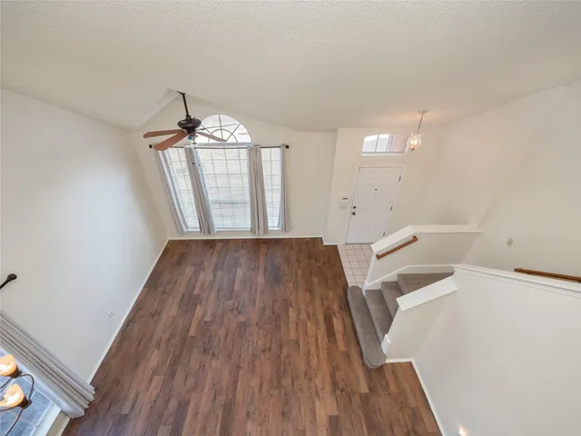 a view of a living room and hardwood floor