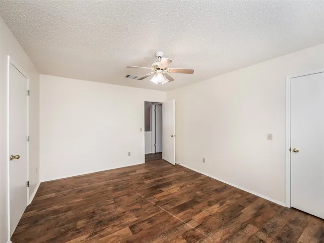 a view of a house with a wooden deck