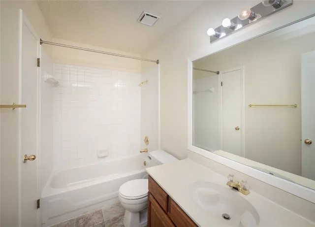 a view of a yard with a large tree