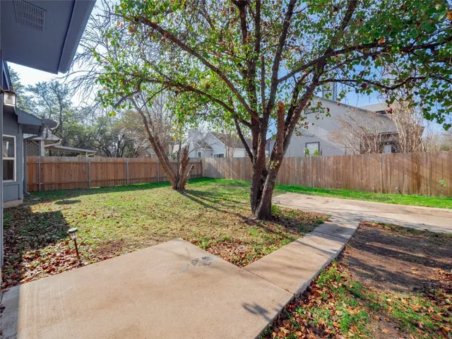 a view of backyard with tree