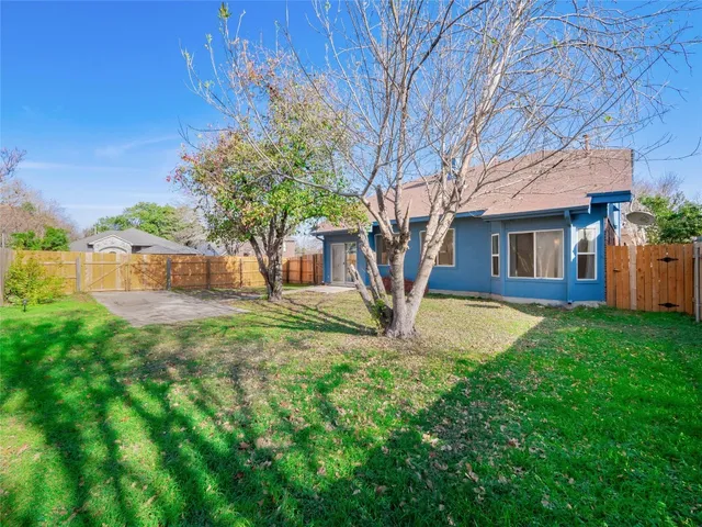 a front view of a house with yard