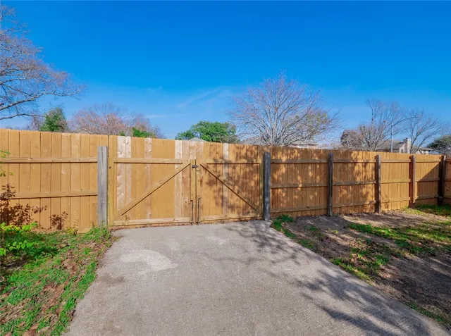 an aerial view of a house with a mountain