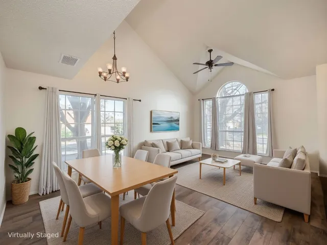 a view of a dining room with furniture window and outside view