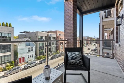 a view of a balcony with city view