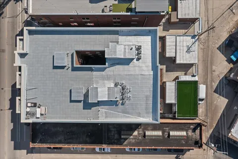 a front view of a house with a street