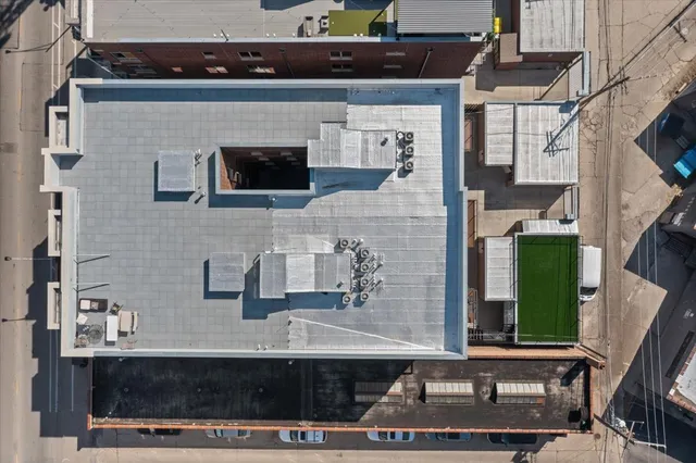 a front view of a house with a street