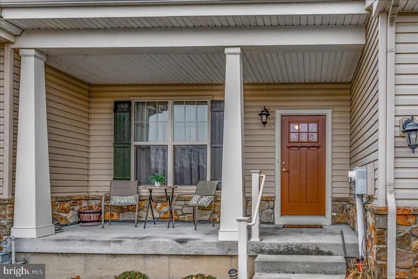 a view of house with outdoor seating space