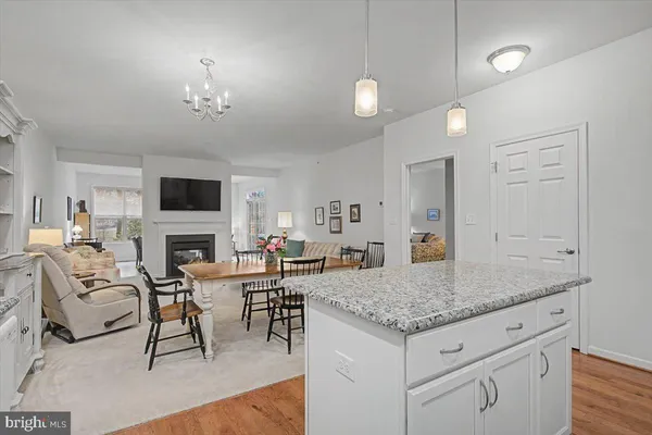 a view of living room with granite countertop furniture and fireplace