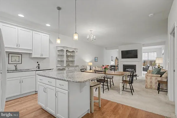 a view of kitchen with sink and cabinets