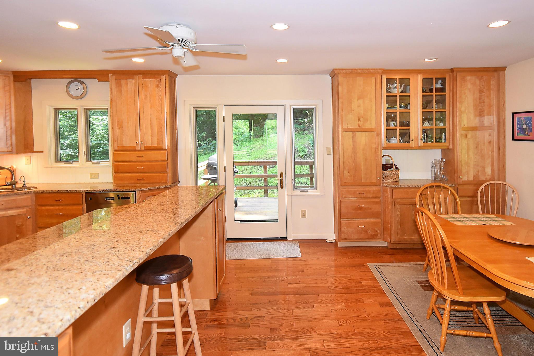 14800 Reserve Road Accokeek, MD 20607 - Photo 5 of 10 Kitchen/dining opens to wrap around deck