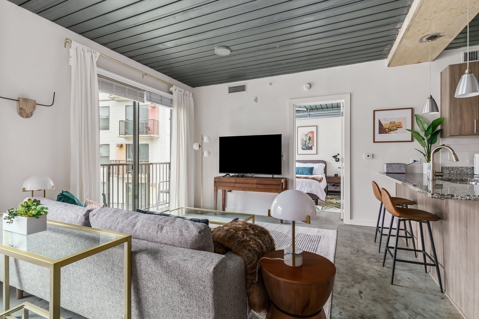 a living room with furniture and a flat screen tv