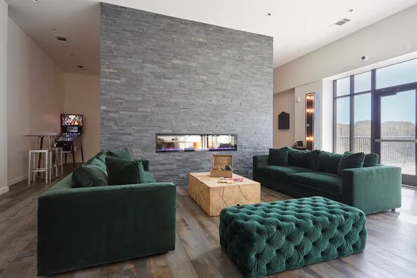 a living room with furniture and a large window