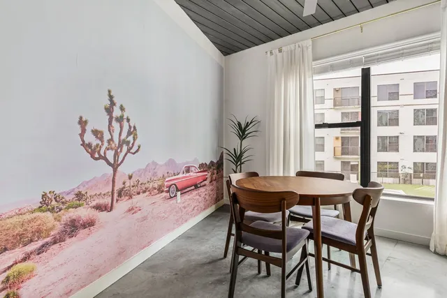 a view of a dining room with furniture and window