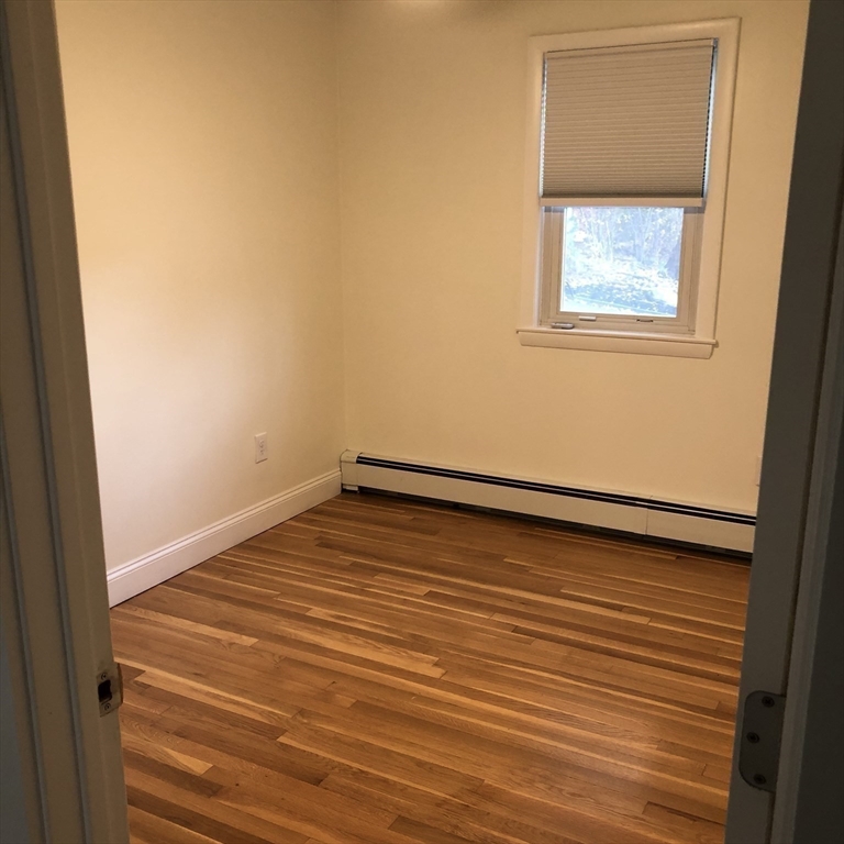 46 Legate Hill Road Leominster, MA 01453 - Photo 11 of 20 a view of empty room with wooden floor and fan