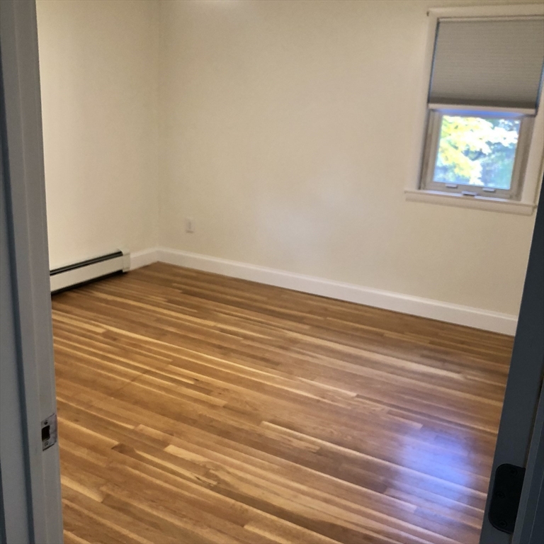 46 Legate Hill Road Leominster, MA 01453 - Photo 13 of 20 a view of empty room with wooden floor and fan