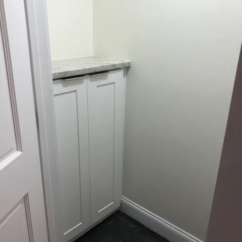 a bathroom with a granite countertop sink and vanity