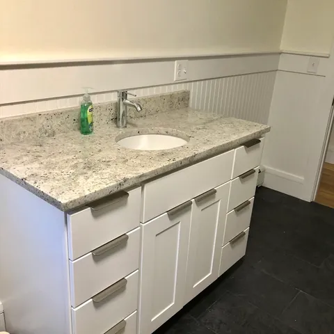 a bathroom with a sink and vanity