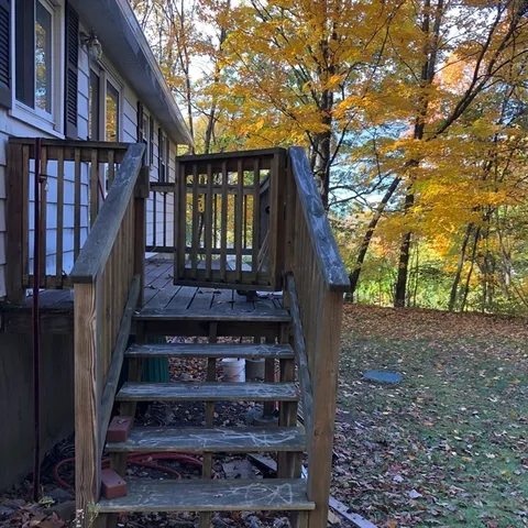 a view of a house with a small yard