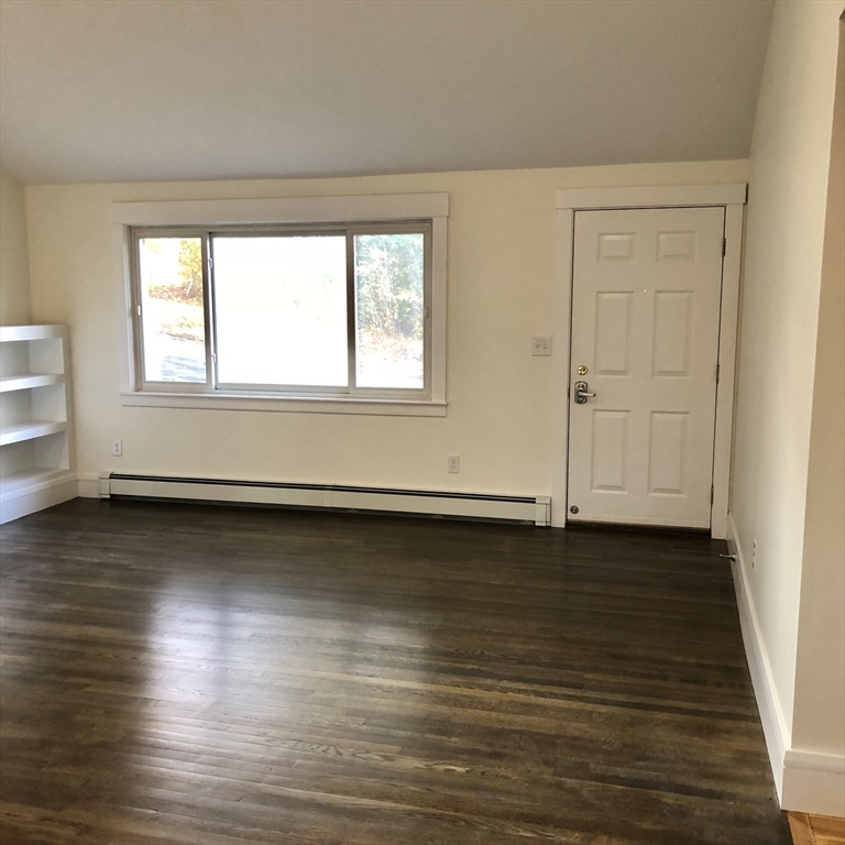 46 Legate Hill Road Leominster, MA 01453 - Photo 3 of 20 a view of a room with wooden floor and window