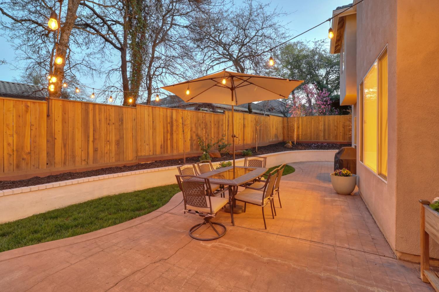 3835 Deer Ridge Lane Auburn, CA 95602 - Photo 62 of 79 a backyard of a house with table and chairs
