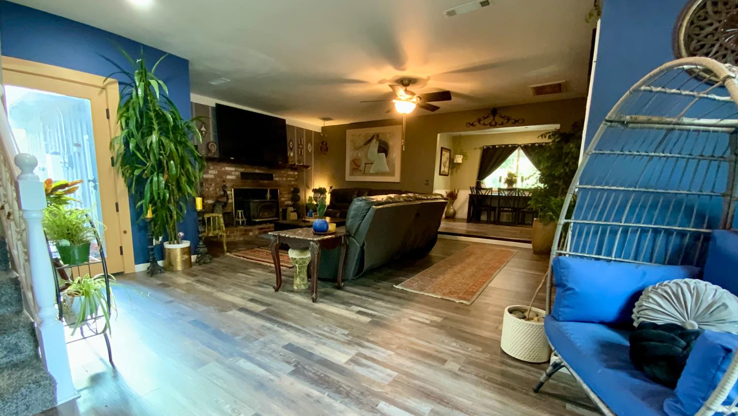 48833 Rock Point Road Oakhurst, CA 93644 - Photo 11 of 36 a living room with furniture a flat screen tv and kitchen view