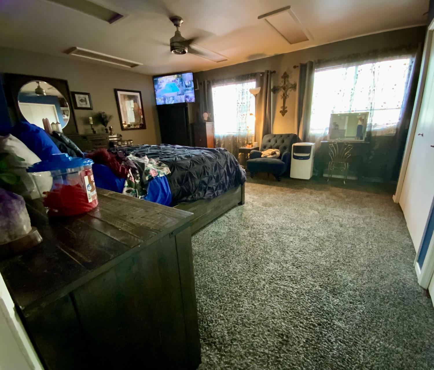 48833 Rock Point Road Oakhurst, CA 93644 - Photo 14 of 36 a living room with furniture a window and a flat screen tv