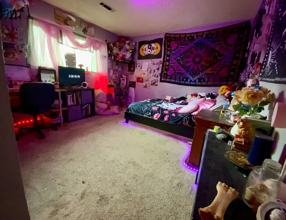 a bedroom with furniture and a potted plant