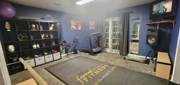 a room with lots of furniture and a rug