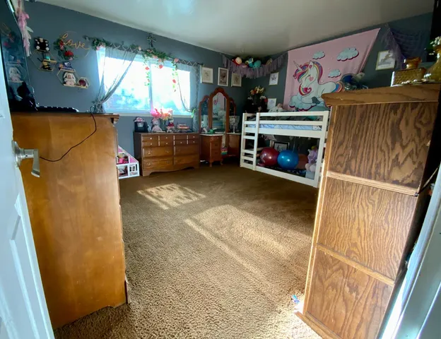 a room with a mirror and a lamp