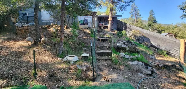 an aerial view of house with a yard