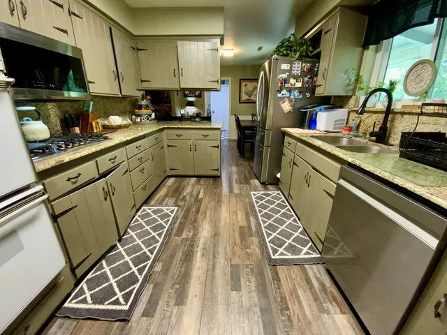 a bedroom with a bed and a large mirror