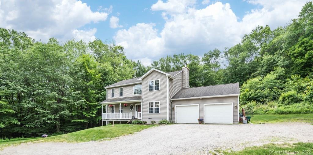 11 Spring Hill Road Harwinton, CT 06791 - Photo 1 of 1 Front exterior shows covered front porch, 2 car garage,and ample parking areas.