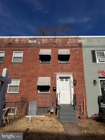 a view of a brick building with many windows