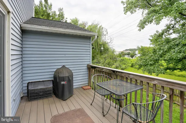 a view of balcony with furniture and wooden deck