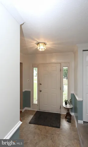 an empty room with windows and a table