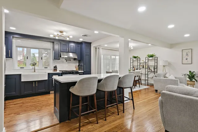 a large kitchen with a table and chairs