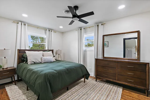 a bedroom with a bed and a dresser