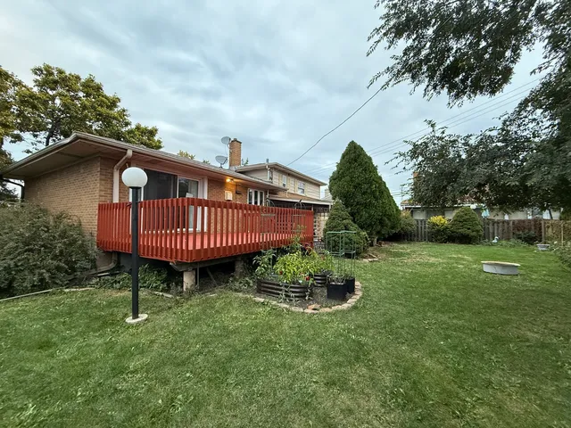 a view of a garden with a deck