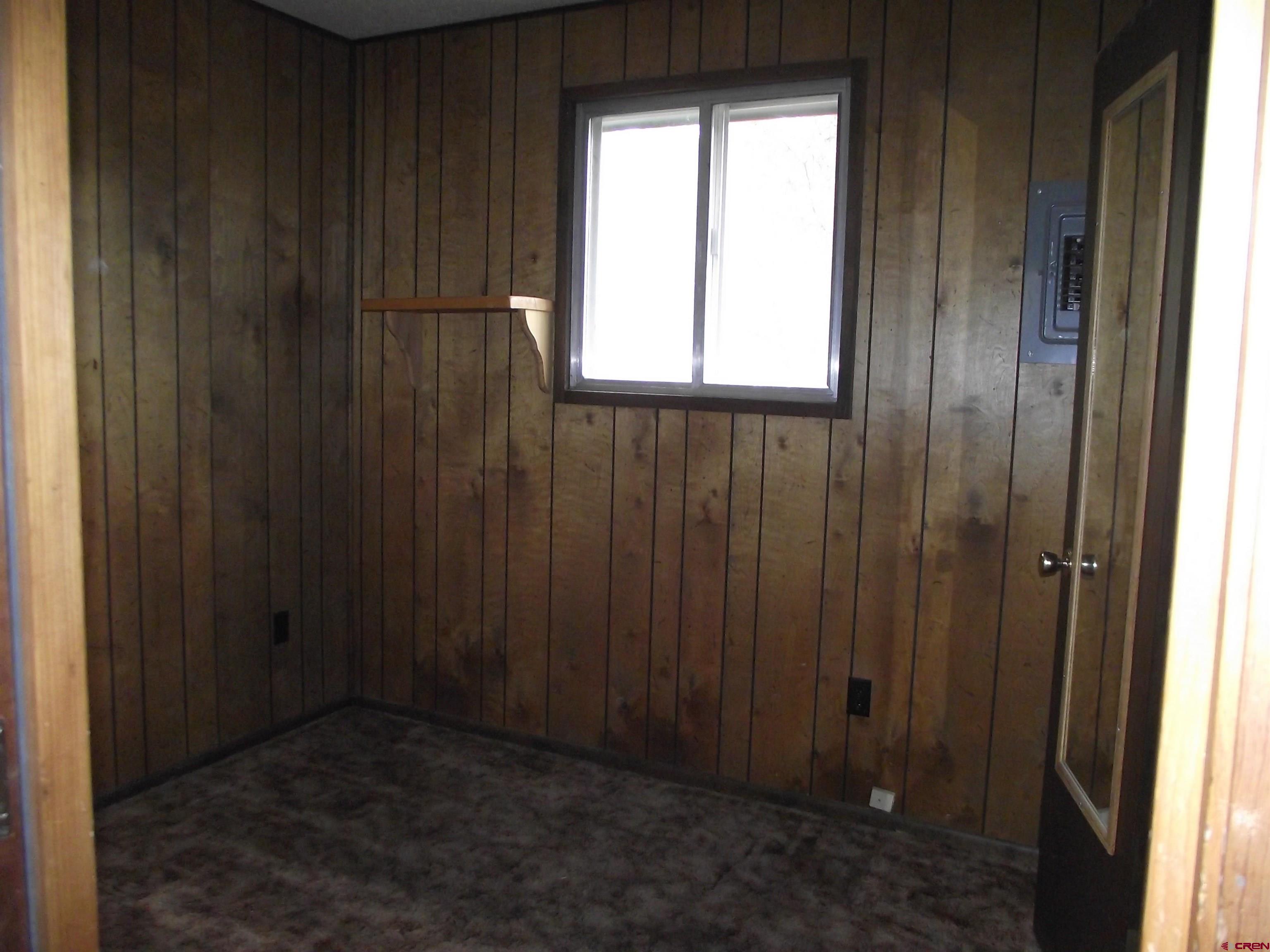 42996 Needle Rock Road Crawford, CO 81415 - Photo 24 of 45 an empty room with windows