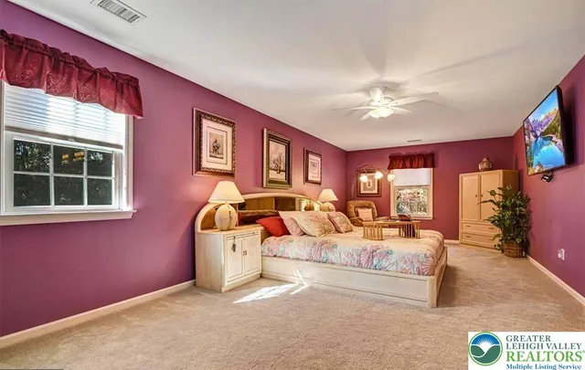 a living room with furniture a rug and a window