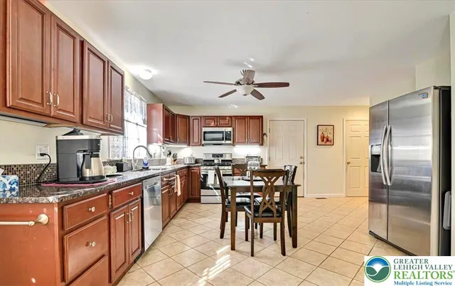 a spacious bathroom with a sink and a mirror