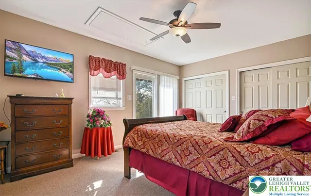 a bedroom with bed and window