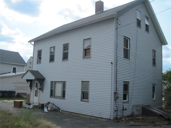 43 Pulaski Street Ware, MA 01082 - Photo 1 of 1 a view of a house with a yard