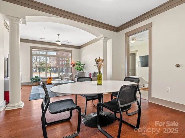 a view of a dining room with furniture and window