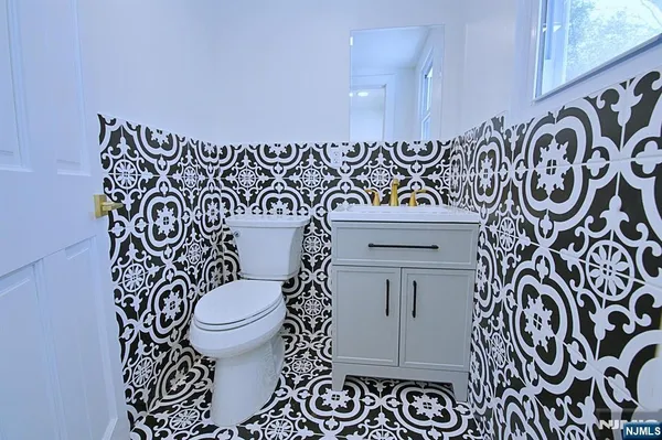 a bathroom with a toilet and a sink